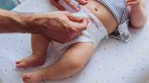 A picture of a baby during diaper change